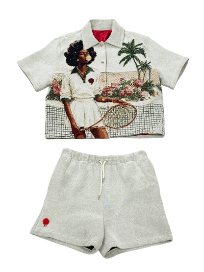 Shirt with graphic design of a woman holding a tennis racket and shorts on a white background